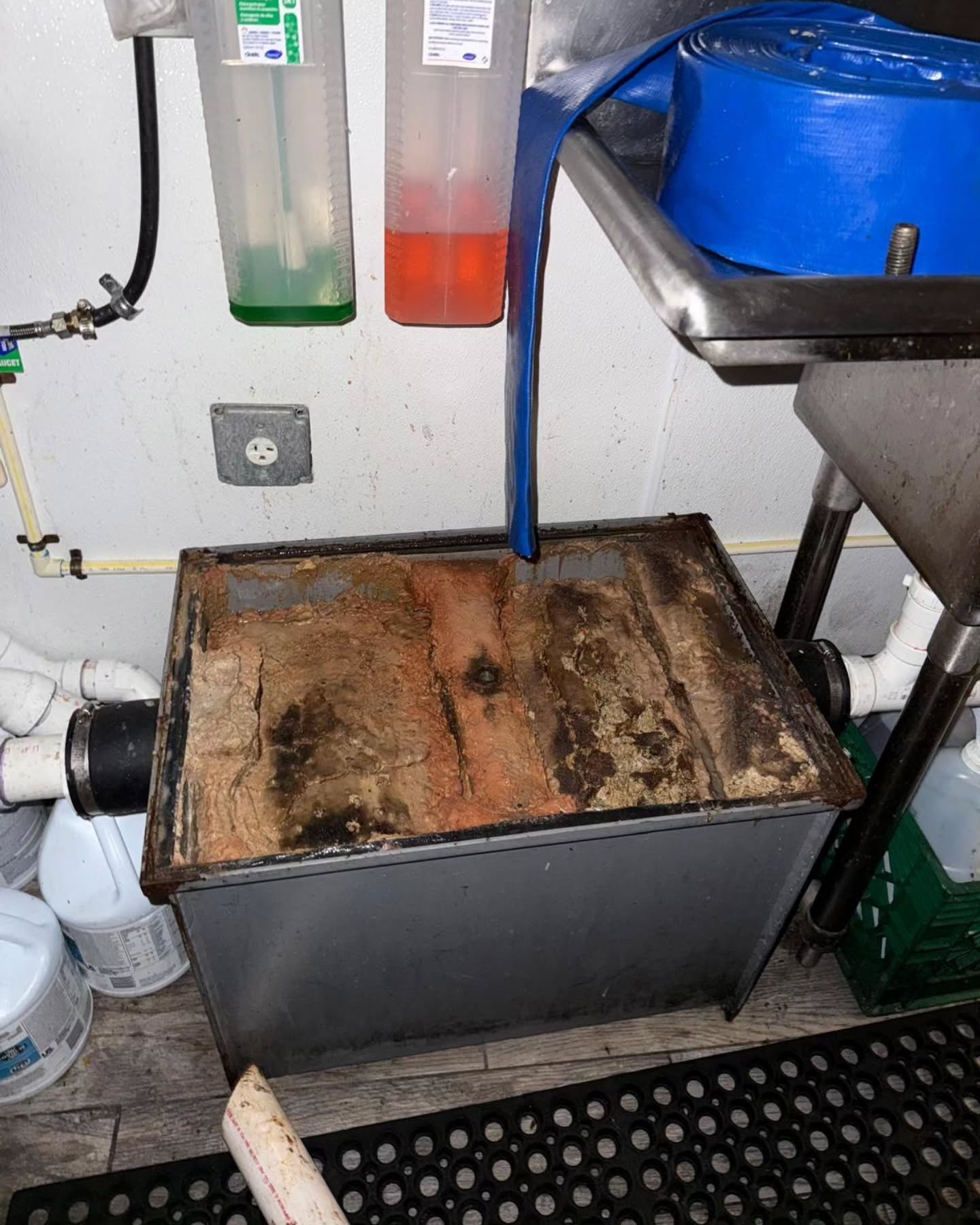 Grease trap before cleaning - clogged and unsanitary