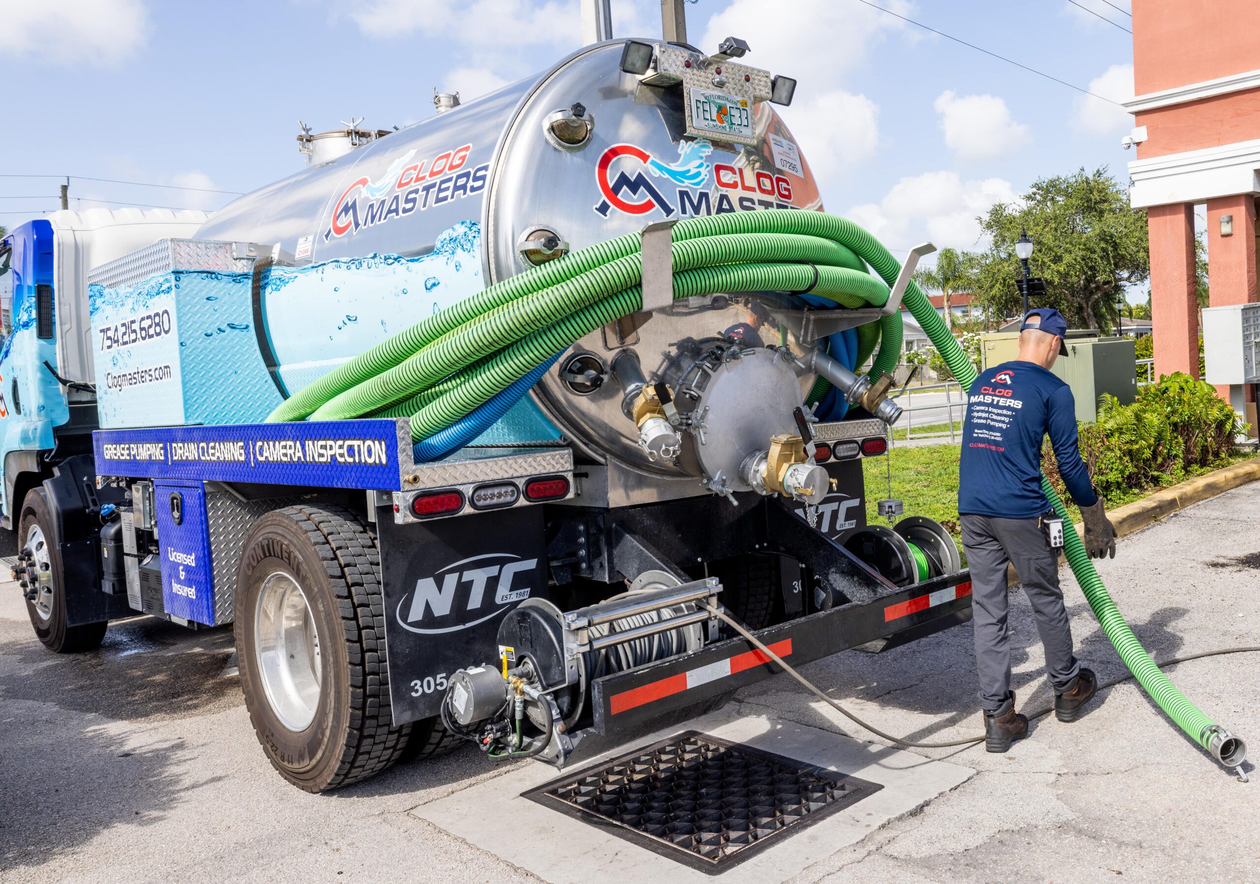 Drain Cleaning in Hollywood FL 3 ClogMasters vacuum truck clearing a main drain line for a commercial property in Broward County