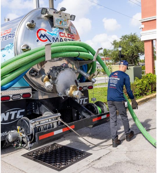 Main Sewer Line Clog: 7 Warning Signs for Hollywood Homeowners 1 ClogMasters crew clearing a main sewer line